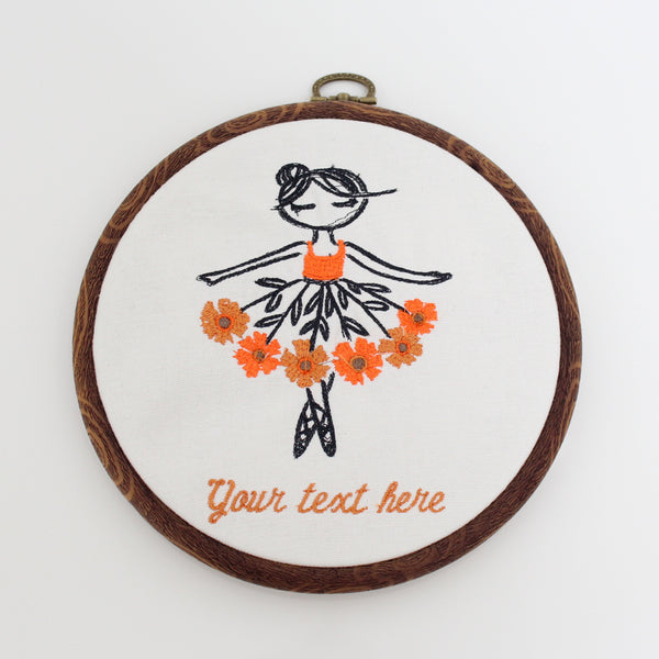 Handmade Embroidered Ballerina flower with Personalized text   Frame size: 6" Design: Ballerina Color of her dress: Orange Color of text: Cinnamon  Text: Please send us your text (up to three words) 